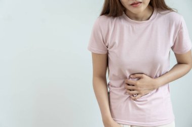 stomach ache. Asian women have abdominal pain, indigestion, gastritis, menstrual cramps, flatulence, diarrhea, distention, colon cancer, belly inflammation problem, suffer food poisoning, abdomen