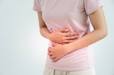 stomach ache. Asian women have abdominal pain, indigestion, gastritis, menstrual cramps, flatulence, diarrhea, distention, colon cancer, belly inflammation problem, suffer food poisoning, abdome
