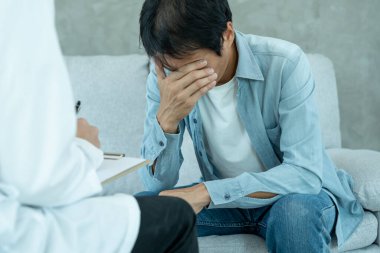 man with mental health problems is consulting. psychiatrist is recording the patient's condition for treatment. encouragement, love and family problem, bipolar , depression patient, protect suicide