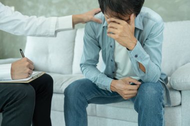 man with mental health problems is consulting. psychiatrist is recording the patient's condition for treatment. encouragement, love and family problem, bipolar , depression patient, protect suicide