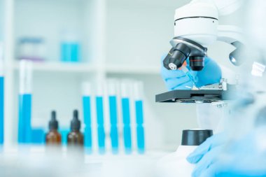 Scientist analyze biochemical samples in advanced scientific laboratory. Medical professional use dropper mix microbiological developmental of viral. Biotechnology research in  science lab. cosmetic