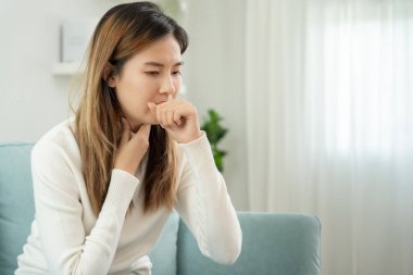 sick woman with a headache and feeling cold on sofa, female sneezing and runny nose with seasonal influenza, allergic, high fever and influenza, resting, virus, coronavirus, feel illness, respiratory