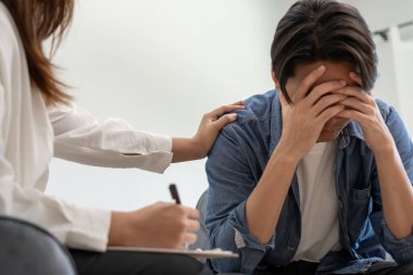 man with mental health problems is consulting. psychiatrist is recording the patient's condition for treatment. encouragement, love and family problem, bipolar , depression patient, protect suicide