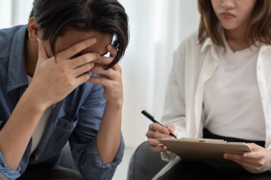 man with mental health problems is consulting. psychiatrist is recording the patient's condition for treatment. encouragement, love and family problem, bipolar , depression patient, protect suicide