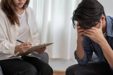 man with mental health problems is consulting. psychiatrist is recording the patient's condition for treatment. encouragement, love and family problem, bipolar , depression patient, protect suicide