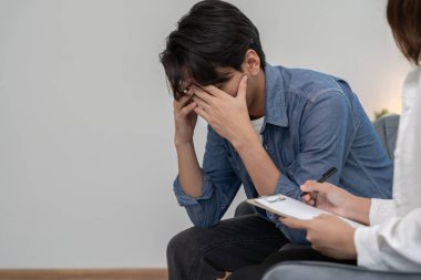 man with mental health problems is consulting. psychiatrist is recording the patient's condition for treatment. encouragement, love and family problem, bipolar , depression patient, protect suicide