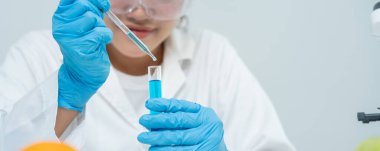 Scientist analyze biochemical samples in advanced scientific laboratory. Medical professional use dropper mix microbiological developmental of viral. Biotechnology research in  science lab. cosmetic
