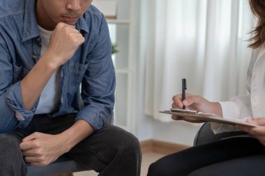 man with mental health problems is consulting. psychiatrist is recording the patient's condition for treatment. encouragement, love and family problem, bipolar , depression patient, protect suicide