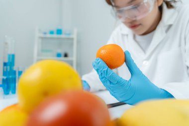 Scientist check chemical food residues in laboratory. Control experts inspect quality of fruits, vegetables. lab, hazards, ROHs, find prohibited substances, contaminate, Microscope, Microbiologist