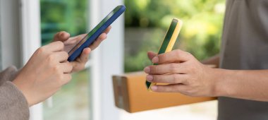 Happy smile Asian woman scan QR code for pay of food. Delivery man send deliver express. online shop, paper container, takeaway, postman, delivery service, packages, electronic money, Digital transfe