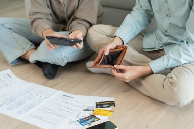 Stressed and headache asian couple with large bills or invoices no money to pay to expenses and business problem. shortage, Financial problems, mortgage, loan, bankruptcy, bankrupt, poor