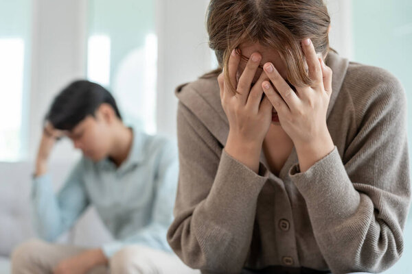 Divorce. Asian couples are desperate and disappointed after marriage. Husband and wife are sad, upset and frustrated after quarrels. distrust, love problems, betrayals. family problem, teenage love