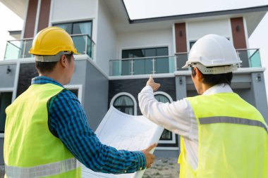 inspector engineer and owner project is inspecting construction and quality assurance new house. Engineers or architects or contactor work to build the house before handing it over to the homeowner