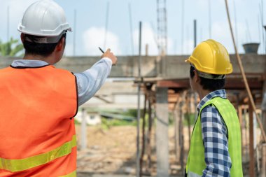 inspector engineer and owner project is inspecting construction and quality assurance new house. Engineers or architects or contactor work to build the house before handing it over to the homeowner