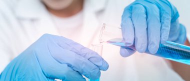 Scientist analyze biochemical samples in advanced scientific laboratory. Medical professional use dropper mix microbiological developmental of viral. Biotechnology research in  science lab. cosmetic