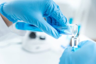 Scientist analyze biochemical sample in advanced scientific laboratory. Medical professional check chemical mix microbiological developmental of viral. Biotechnology research in science lab. cosmetic