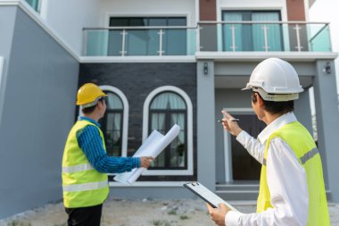 inspector engineer and owner project is inspecting construction and quality assurance new house. Engineers or architects or contactor work to build the house before handing it over to the homeowner