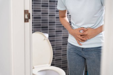 stomach ache. Asian women have abdominal pain, indigestion, gastritis, menstrual cramps, flatulence, diarrhea, distention, colon cancer, belly inflammation problem, suffer food poisoning, abdomen