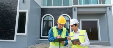 inspector engineer and owner project is inspecting construction and quality assurance new house. Engineers or architects or contactor work to build the house before handing it over to the homeowner