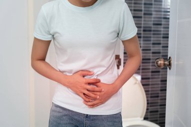Constipation and diarrhea in bathroom. Hurt woman touch belly  stomach ache painful. colon inflammation problem, toxic food, abdominal pain, abdomen, constipated in toilet, stomachache, Hygiene