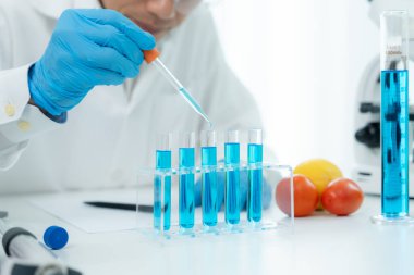 Scientist analyze biochemical samples in advanced scientific laboratory. Medical professional use dropper mix microbiological developmental of viral. Biotechnology research in  science lab. cosmetic