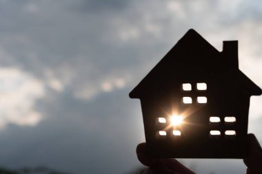 lease, rental and selling home. silhouette hand hold new house or real estate, rent house, Sales, loan credit financial, insurance, Seller, dealer, installment,  buy, sell, move in