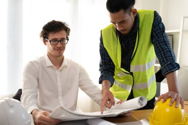 inspector engineer and owner project is inspecting construction and quality assurance new house. Engineers or architects or contactor work to build the house before handing it over to the 