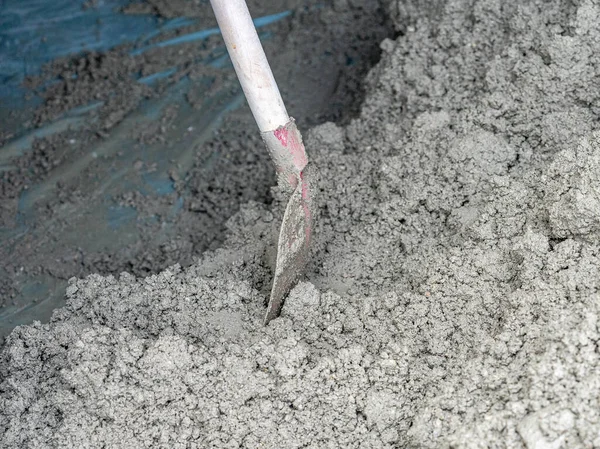 stock image Shovel with concrete for house construction