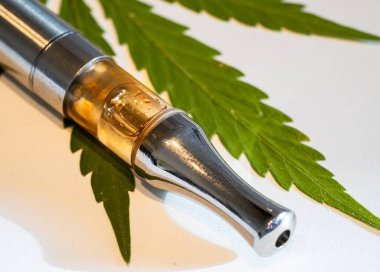 CBD vaporizer with a cannabis leaf isolated clipart