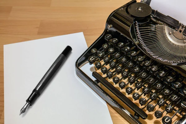 stock image Old antique typewriter with fountain pen and paper