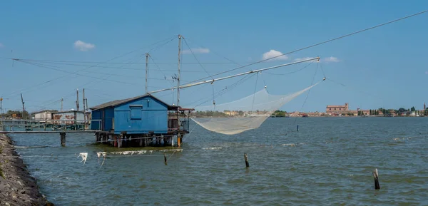 stock image Fishing hut with net in Italy