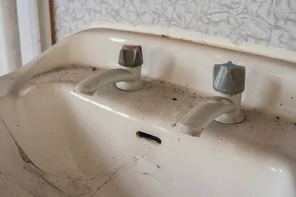 Old dilapidated sink from the 70\'s