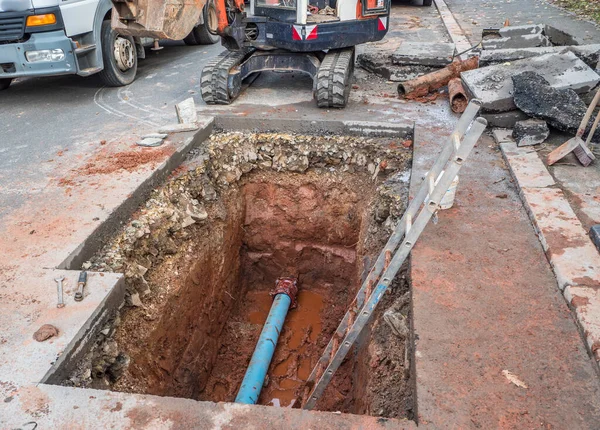 New construction of a water pipe in a street construction site