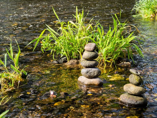 Balance stones in a river 01