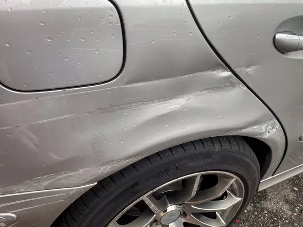 Car with dents and paint damage after an accident