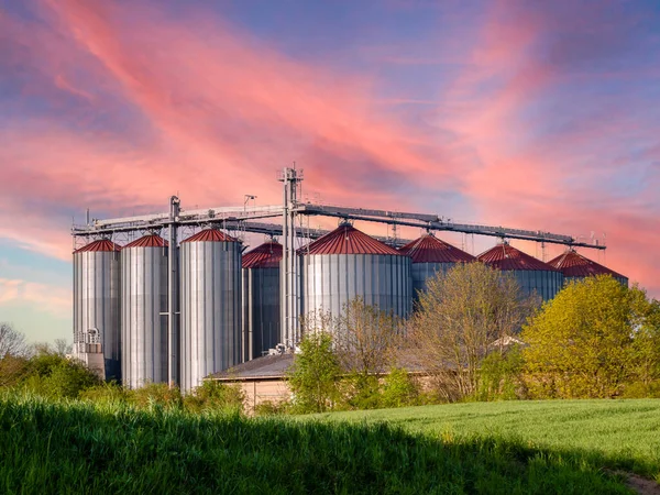Grain silo on a farm with sunset