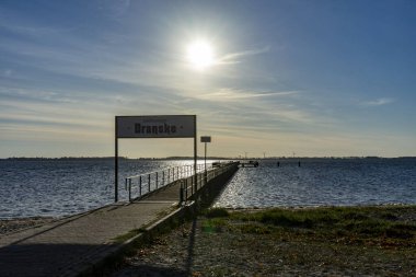 Boat pier with Dranske pier on the island of Ruegen on the Baltic Sea clipart