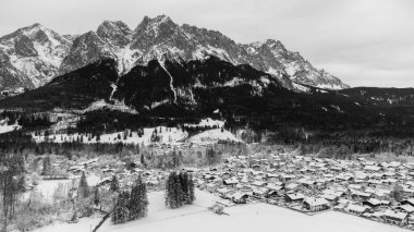 View of the town of Grainau with the Zugspitze in the background, Bavaria, German Alps black and white clipart