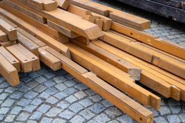 Lumber, wooden beams on a construction site for the carpenter clipart