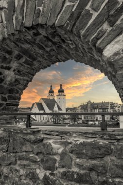 view of the city church from the old castle in plauen vogtland east germany at sunset vertical clipart