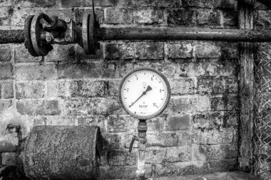 Old air pressure manometer in an abandoned old factory ruin from the former GDR East Germany clipart