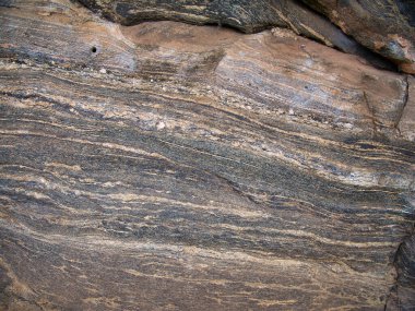 Strata of cooled granite at the Mirror Wall on Sigiriya or Lion Rock in central Sri Lanka. clipart