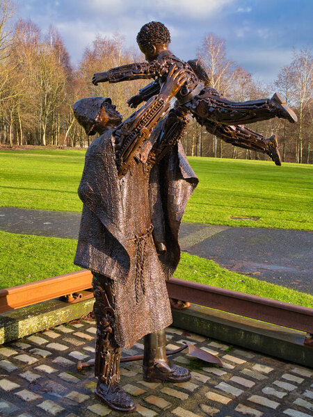 St Helens, UK - Jan 4 2024: The Worker's Memorial Statue in St Helens, England, UK. A memorial to workers who have lost their lives at work or suffered from work-related injury and disease.