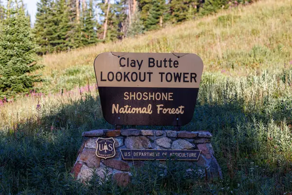 stock image Park County, WY, USA  -  August 15, 2024: Clay Butte Lookout Tower sign near scenic Beartooth Highway 212