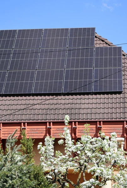 Solar panels on the roof of a house, focus on the solar panels