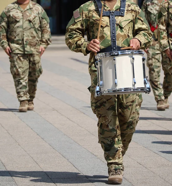 Soldier drummer marching in a row outdoor