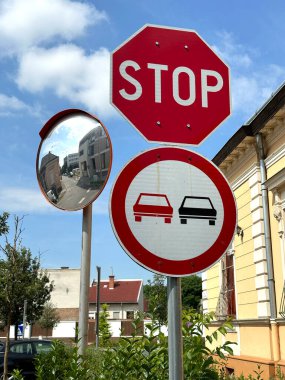 Stop and do not overtaking sign at the road crossing clipart