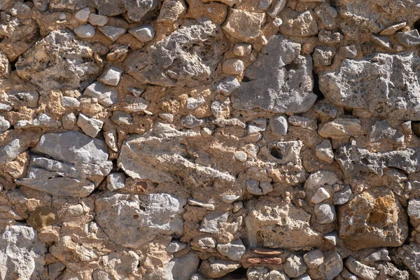 ブロックライトイエロー色のテクスチャと砂岩の古い壁の詳細なテクスチャ背景 — ストック写真