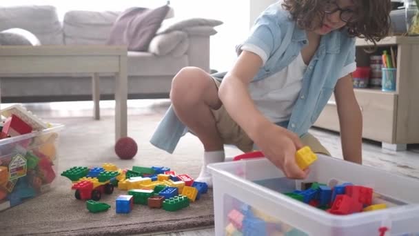 Little Toddler Boy Playing Colorful Plastic Blocks Home Living Room — Stock Video