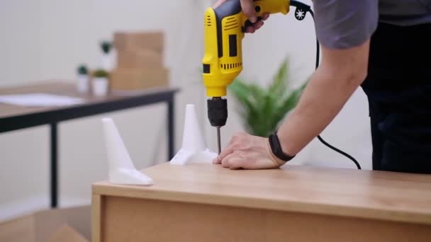 Skilled Carpenter Blue Overalls Using Trusty Yellow Electrical Drill Screwdriver — Stock Video